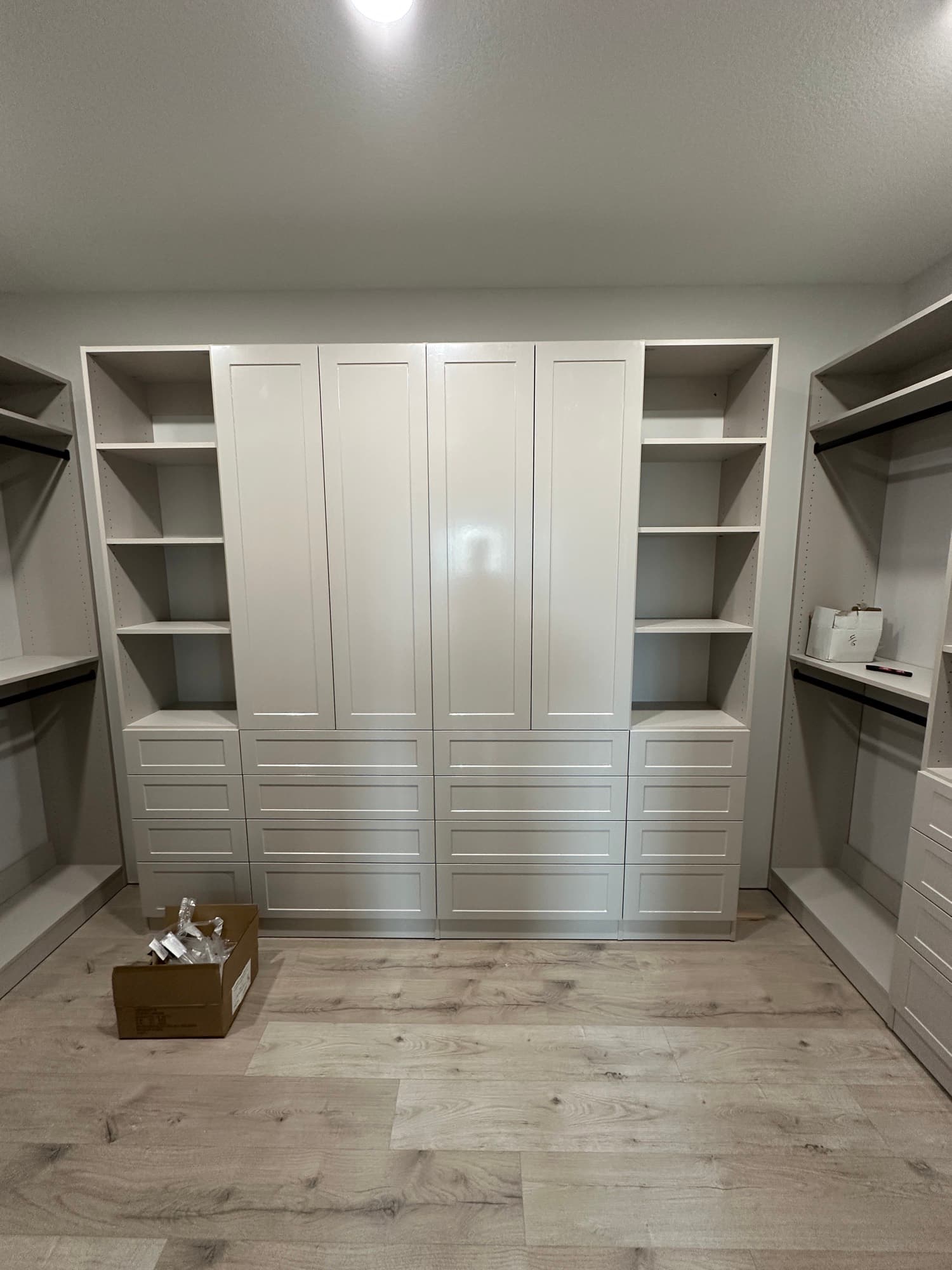 Organized reach-in closet with double hanging and shelving