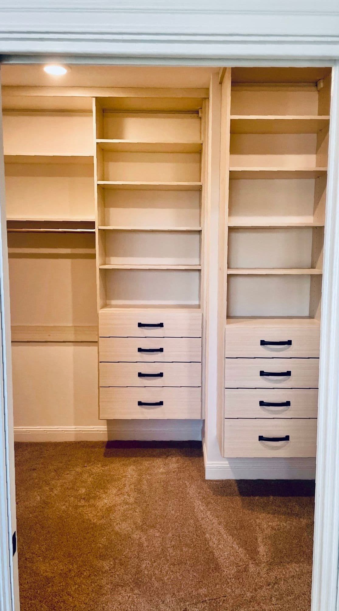 Reach-in closet with drawer bank and double-hang